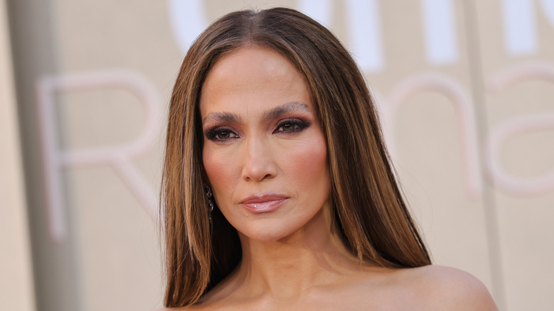 Jennifer Lopez posing with a stern face on the red carpet.
