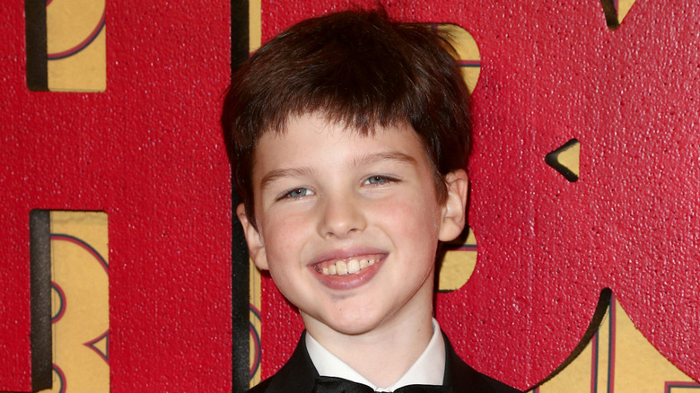 Child Iain Armitage smiling red carpet