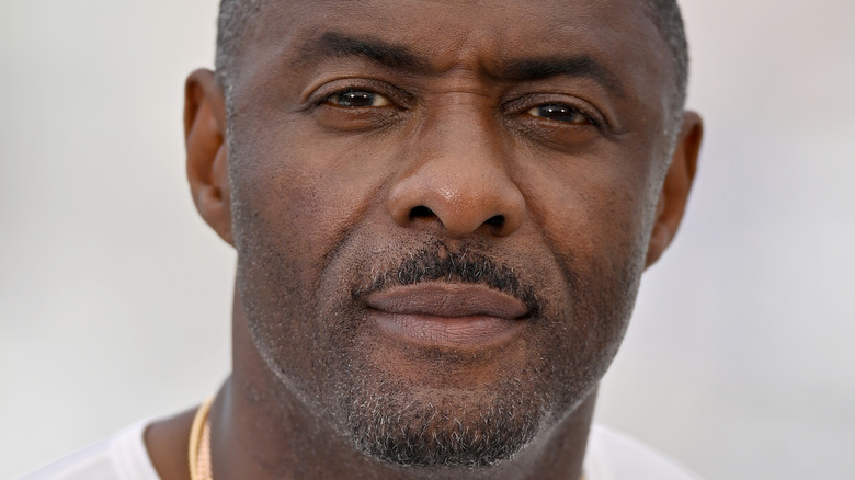Idris Elba against a white backdrop