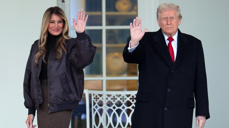 Melania Trump and Donald Trump waving