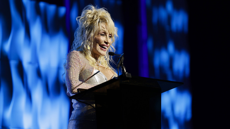 Dolly Parton speaking onstage at the 53rd Anniversary Nashville Songwriters Hall of Fame Gala at Music City Center
