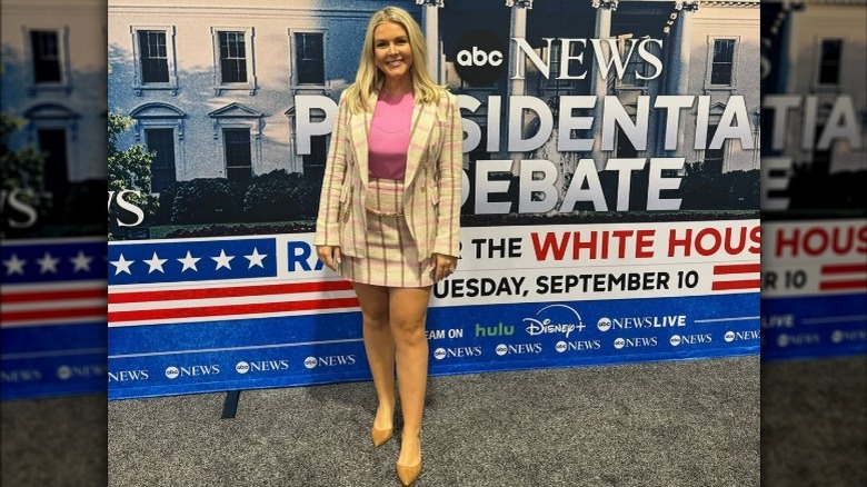 Karoline Leavitt wearing a plaid skirt and blazer