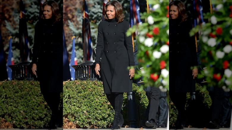 Michelle Obama wearing a Burbery coat while visiting Arlington National Cemetary