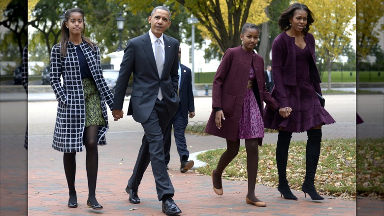 Barack and Michelle Obama walking to church with their daughters Sasha and Malia