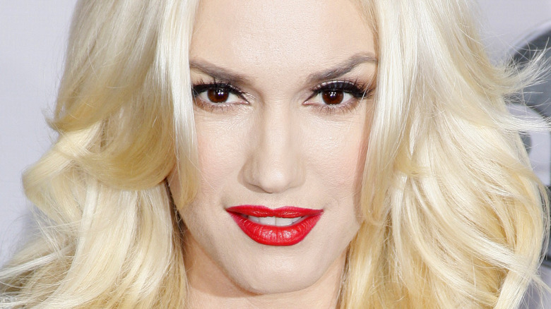 Gwen Stefani posing in red lipstick