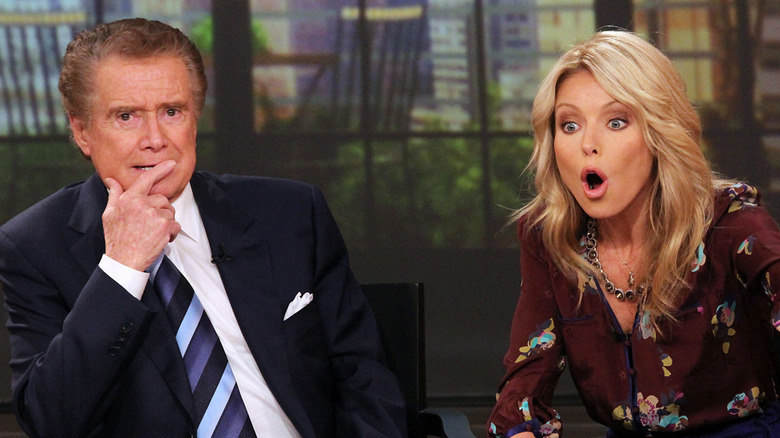 Kelly Ripa looking shocked beside Regis Philbin on "Live! With Regis and Kelly."