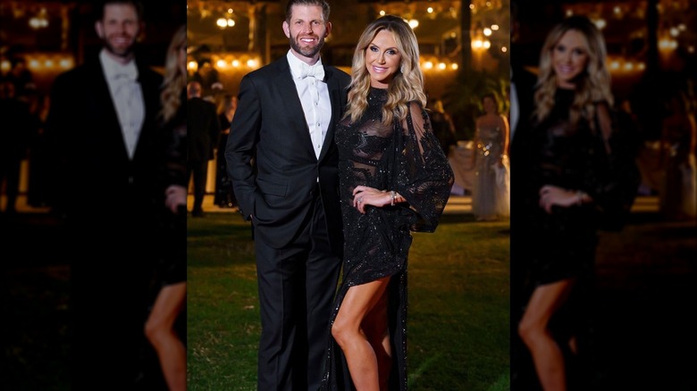 Lara Trump standing with Eric Trump in black lace dress