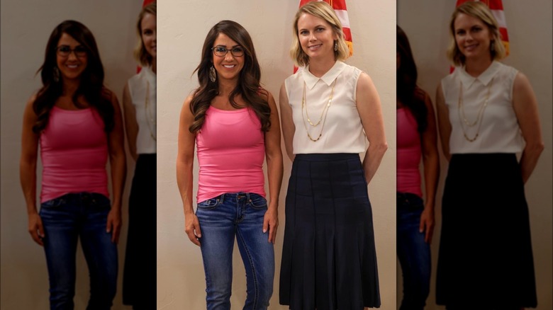 Dressed in a pink tank top, Lauren Boebert stands next to Gunnison County Commissioner Liz Smith while all smiles.