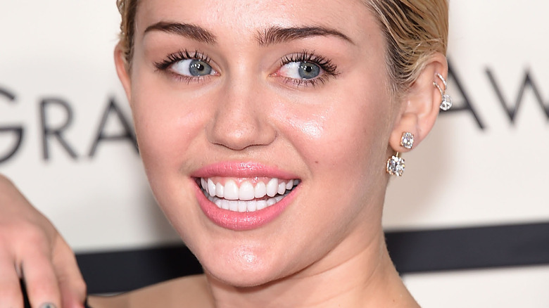 Miley Cyrus wears diamond earrings