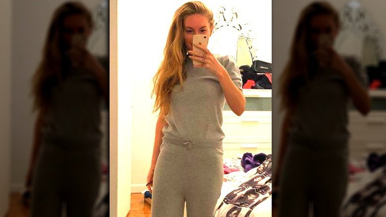 Leah McSweeney wearing grey sweatshirt