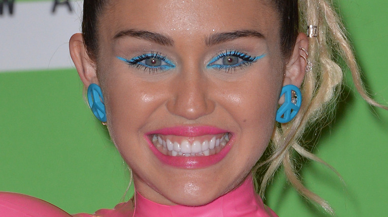 Miley Cyrus with blond dreadlocks