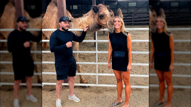 Nikki Glaser and Andrew Collin posing with a camel.