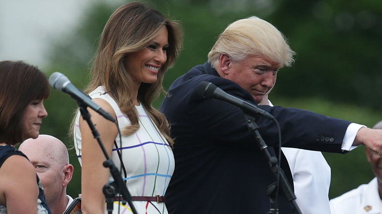 Melania Trump smiling beside Donald Trump