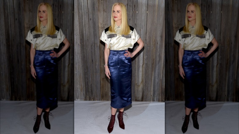 Nicole Kidman wearing cream top, blue skirt