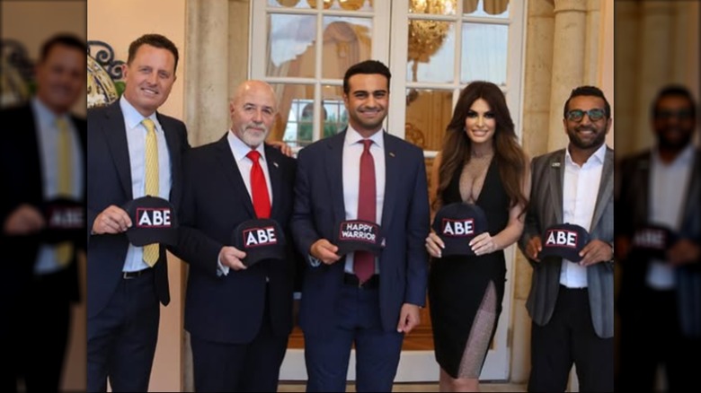 Kimberly Guilfoyle posing with Abraham Hamadeh supporters.