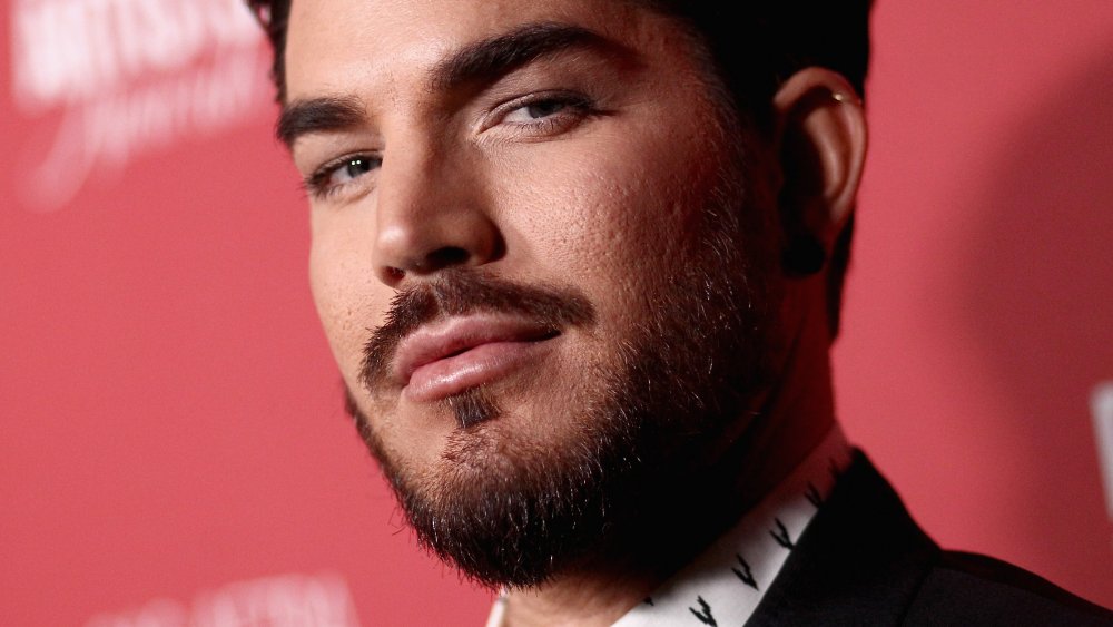 Adam Lambert gives the camera a smoldering look