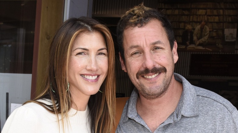 Jackie and Adam Sandler smiling
