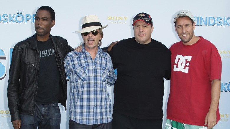 Adam Sandler posing with his Grown Ups co-stars