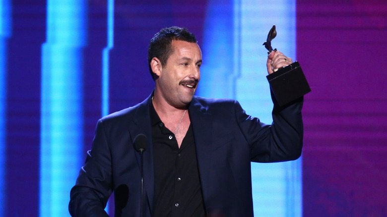 Adam Sandler accepting an award