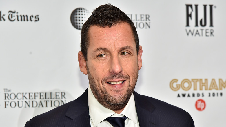 Adam Sandler posing on red carpet