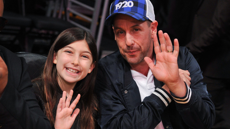Sunny Sandler and Adam Sandler waving