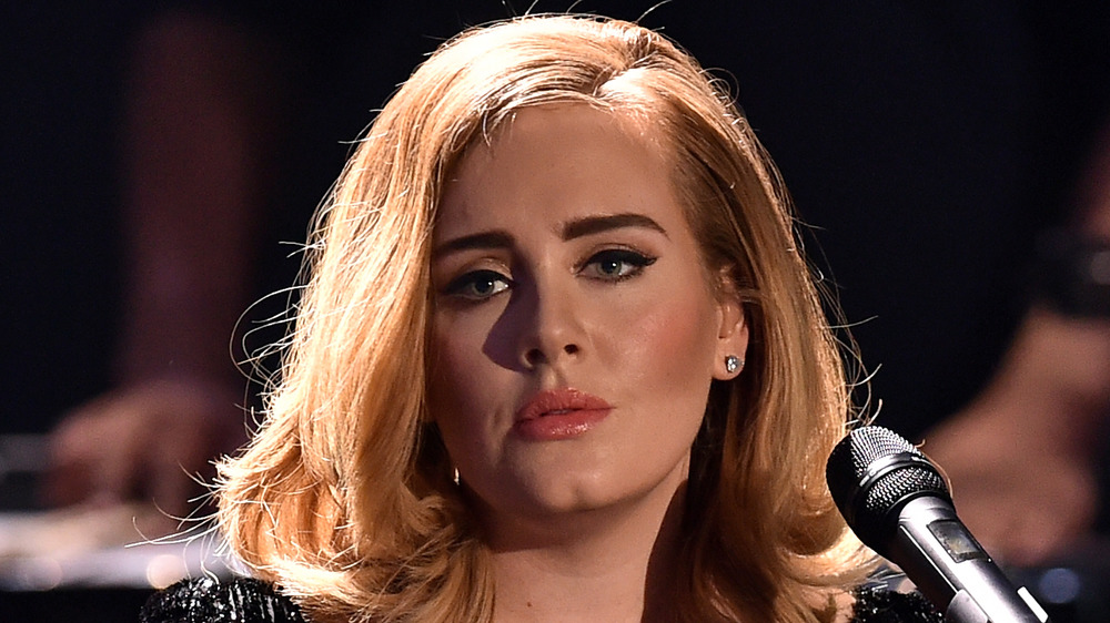 Adele staring with a serious expression