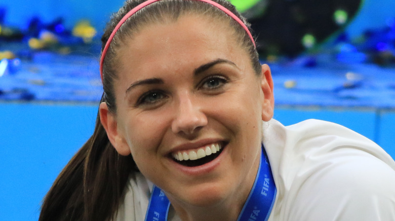 Alex Morgan wearing pink headband