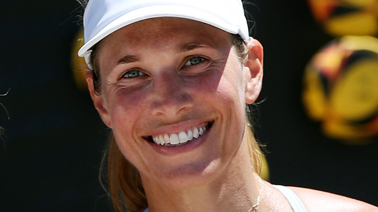 Alix Klineman smiling and wearing visor