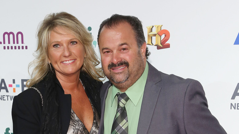 Diann, smiling, Frank Friz, smiling, wearing a suit and green shirt, smiling, 2015 red carpet together