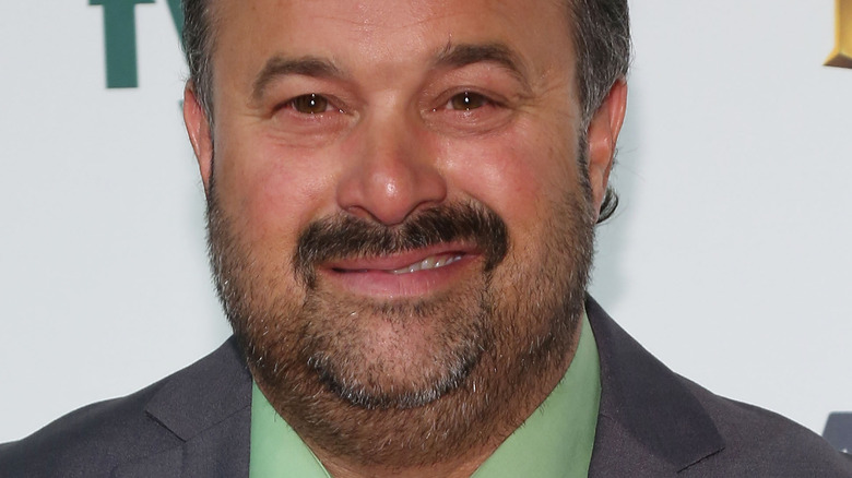 Frank Fritz, smiling, facial hair, wearing a suit, 2015 photo