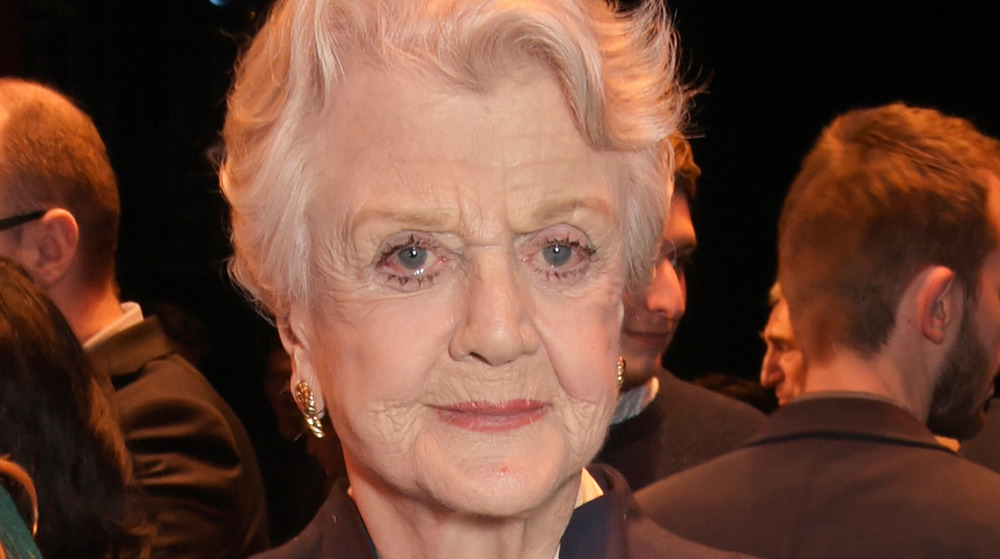 Angela Lansbury with a serious expression at an event