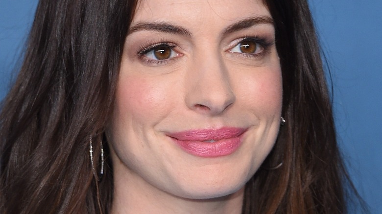 Anne Hathaway smiles