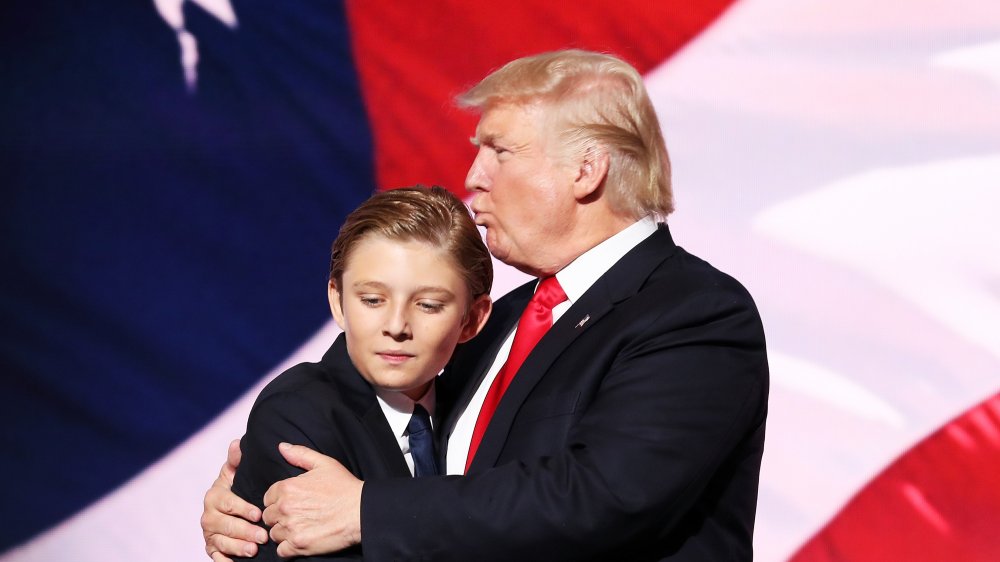 Barron Trump hugging Donald Trump