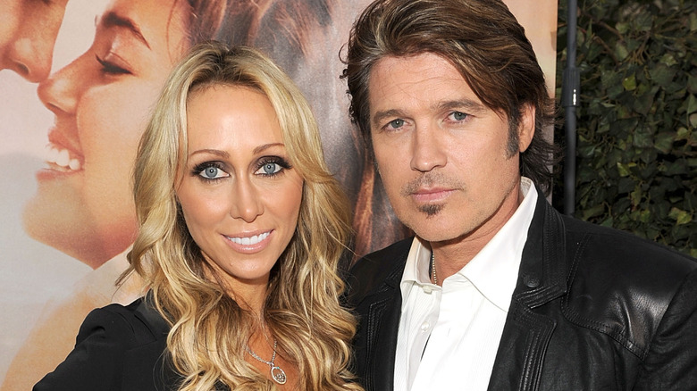 Tish Cyrus, Billy Ray Cyrus, posing for 2010 photo