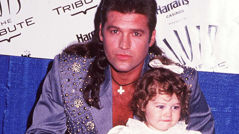 Billy Ray Cyrus, toddler Miley Cyrus, 1994 photo