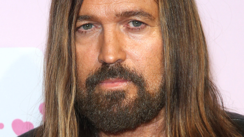 Billy Ray Cyrus long hair, serious