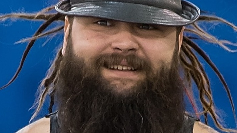 Bray Wyatt smiling in black hat