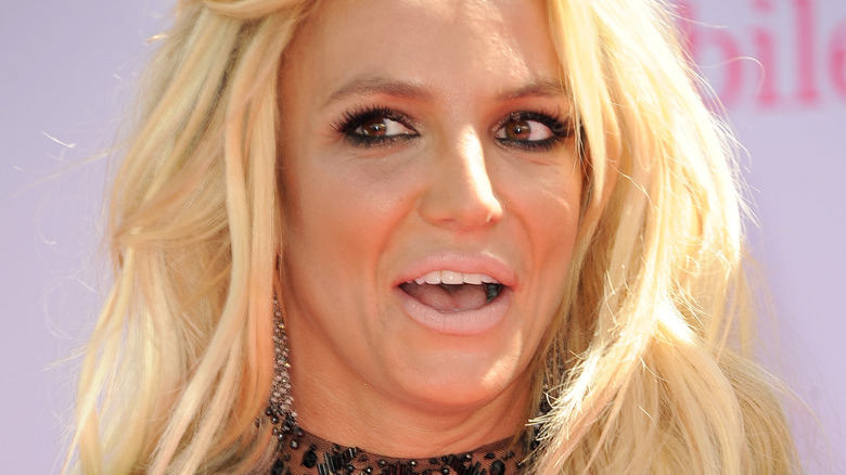 Britney Spears looking to the side with surprised expression