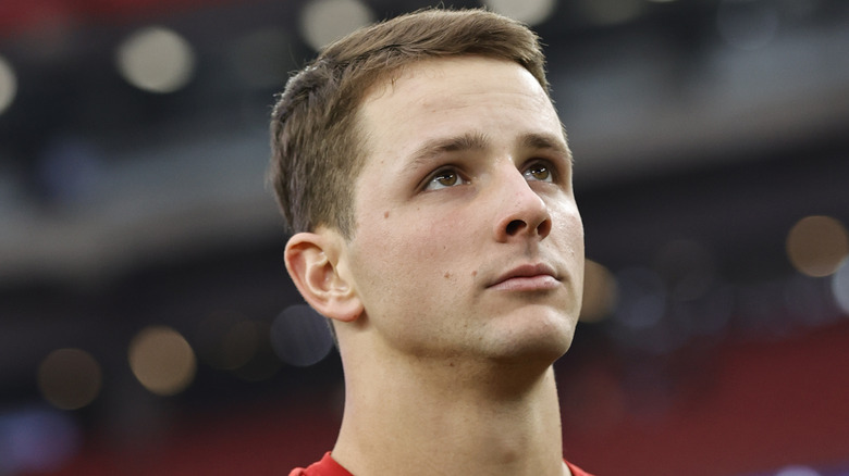 Brock Purdy on football field in close-up