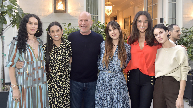 Bruce Willis posing with family