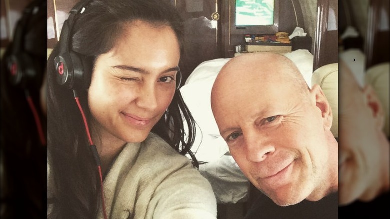 Emma Heming beside Bruce Willis