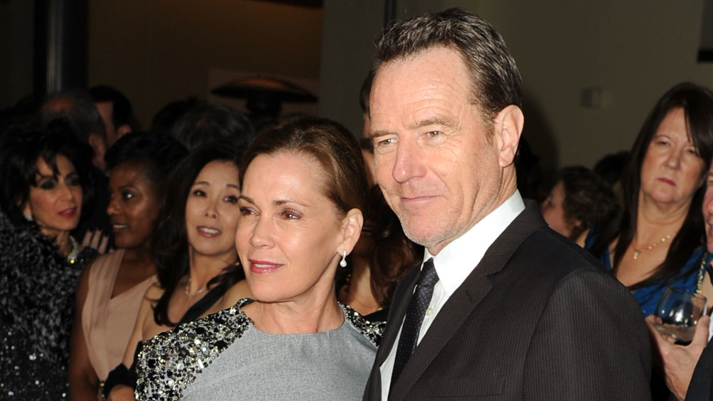 Robin Dearden and Bryan Cranston surrounded by people