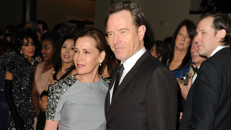 Robin Dearden and Bryan Cranston surrounded by people