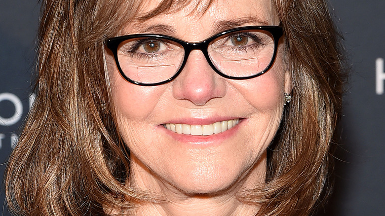 Sally Field poses with black-frame glasses