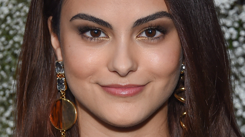 Camila Mendes smiling on red carpet