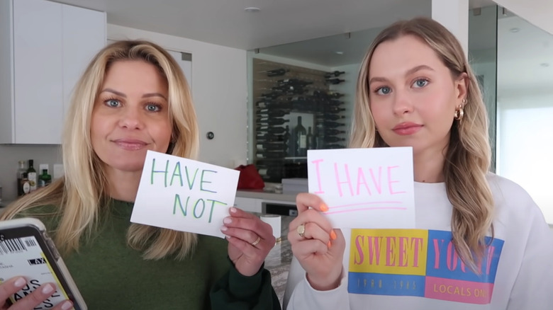 Natasha Bure, Candance Cameron Bure holding cards