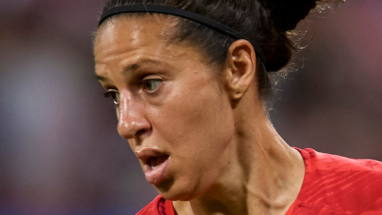 Carli Lloyd on soccer field 