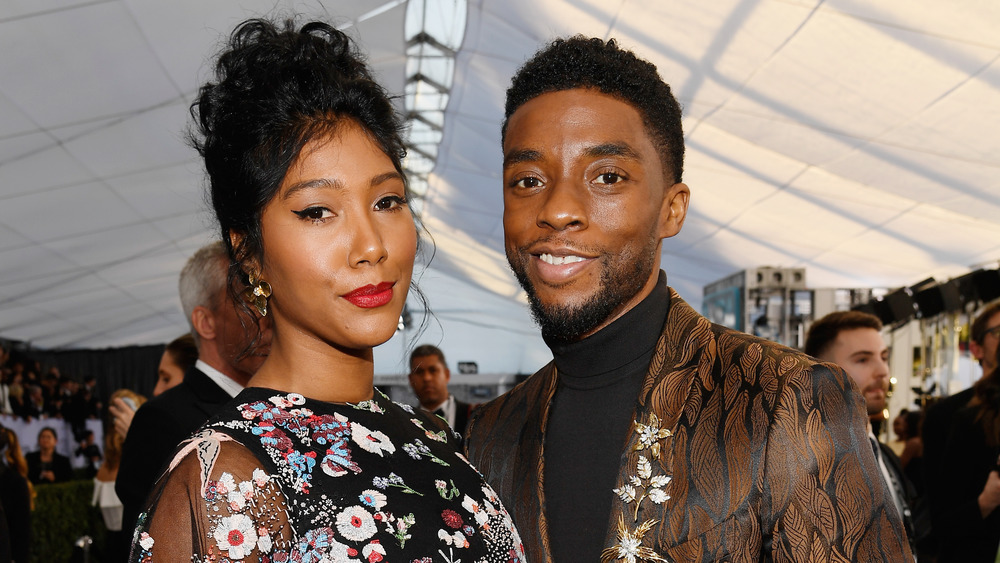 Chadwick Boseman and Taylor Ledward on red carpet