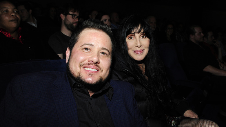 Chaz Bono sitting next to his mother Cher
