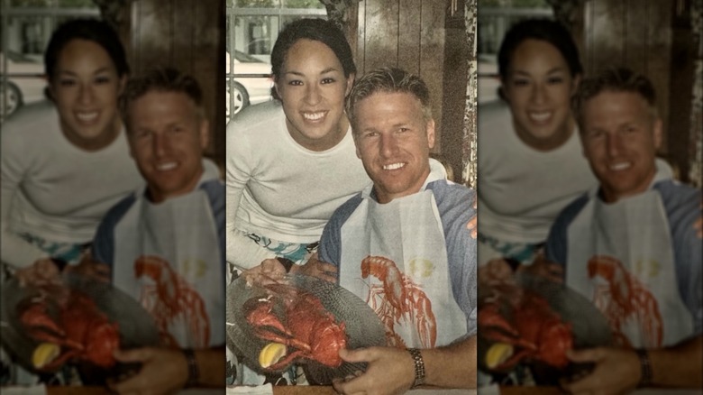 Joanna Gaines and Chip Gaines posing with lobster on a plate